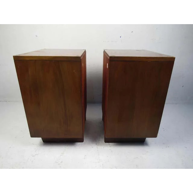 Stylish midcentury nightstands sold by John Stuart. Two dovetail jointed drawers on each, with open storage space beneath....