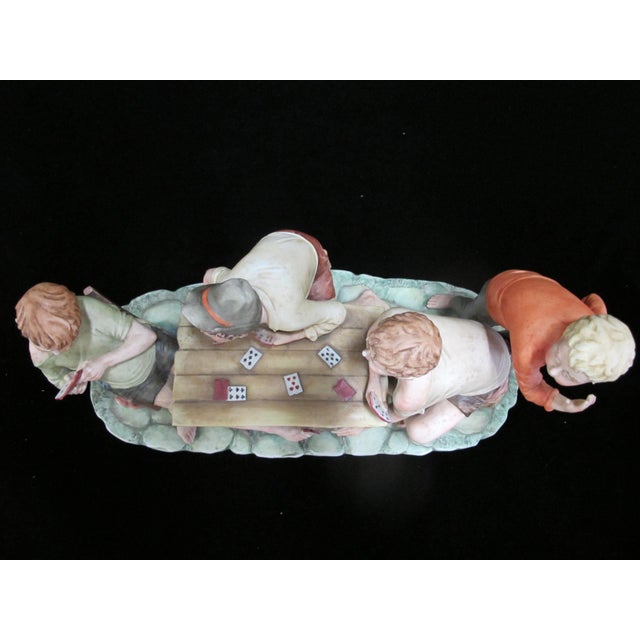 Capodimonte large porcelain figurine, "The Cheaters" by Italian artist Pucci. Depicting four boys playing cards, one of...