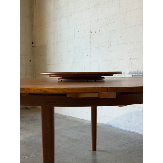 Dyrlund Lotus Round Teak Dining Table With Flip-Out Extension Leaves – Vintage Danish Mid-Century Modern For Sale - Image 10 of 12