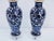 Pair of Chinese Blue and White Lamps with floral design. Custom mounted on clear lucite bases.Wired and in working...