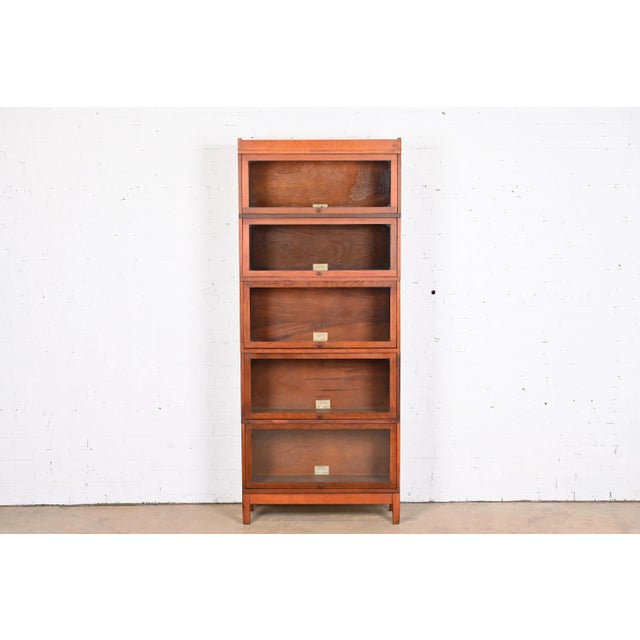 A gorgeous antique Arts & Crafts five-stack barrister bookcase By Globe Wernicke USA, Circa 1900 Mahogany, with glass...