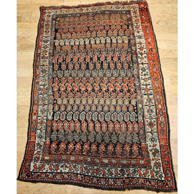 "This vintage hand-knotted Persian Malayer rug from the early 20th century features a captivating allover paisley pattern...