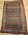 "This vintage hand-knotted Persian Malayer rug from the early 20th century features a captivating allover paisley pattern...
