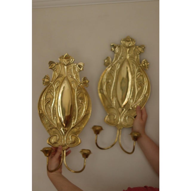 Decorative wall sconces, likely manufactured in the early 20th century They feature characteristic organic, flowing lines...