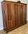 This elegant Vintage French Louis wardrobe showcases refined craftsmanship with beautifully carved panels, graceful...