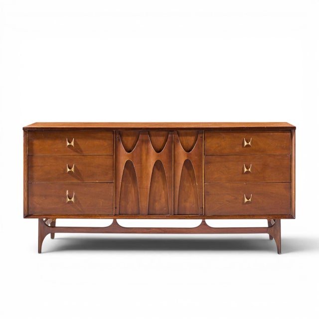 Broyhill Brasilia Mid Century Walnut and Brass Lowboy 9 Drawer Dresser This lowboy measures: 66 wide x 19 deep x 30.75...