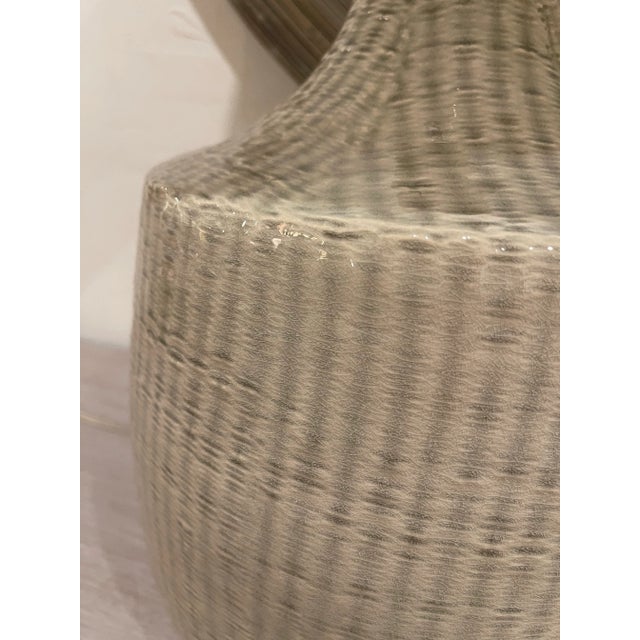 Illuminate your space with this stylish pair of ceramic beige weave lamps. Each lamp features a beautifully textured...