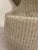 Illuminate your space with this stylish pair of ceramic beige weave lamps. Each lamp features a beautifully textured...