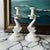 A charming pair of vintage English dolphin-form candlesticks by Hartley Greens & Co. of Leeds Pottery, England. Crafted in...