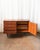 A well-proportioned Polish mid-century credenza in warm mahogany, produced in the 1970s during a period when Eastern...