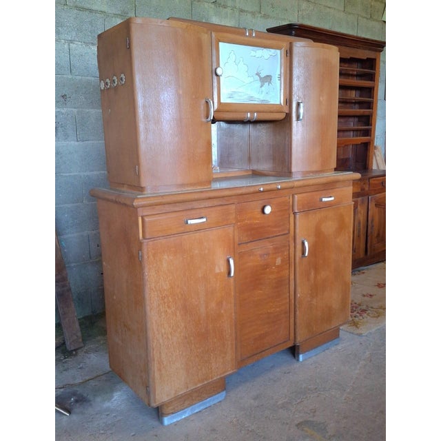 A superb two-part art deco kitchen buffet, dating from the 1940s-1950s, crafted from solid light oak with warm honey and...