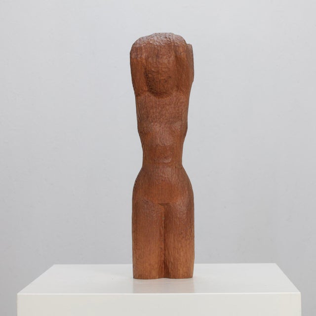 A refined hand-carved female torso titled woman in chains, attributed to dutch artist j. Limperg and dating to the 1970s....