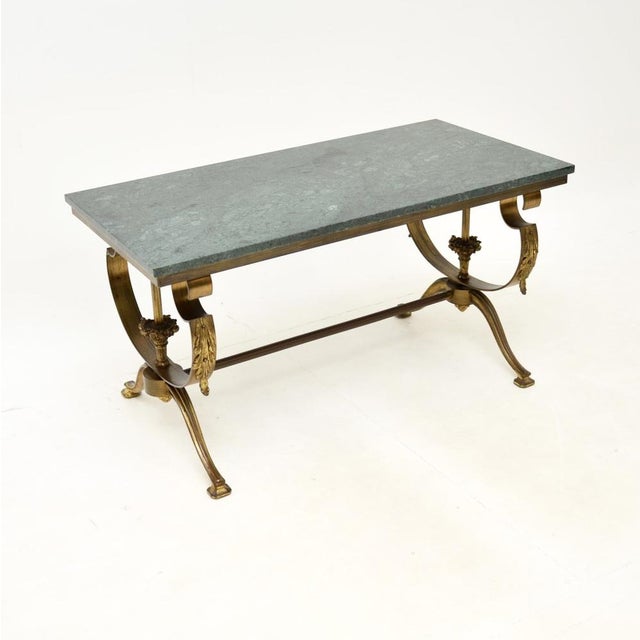 A stunning antique French brass marble top coffee table, dating from around the 1930’s. This is of exceptional quality,...