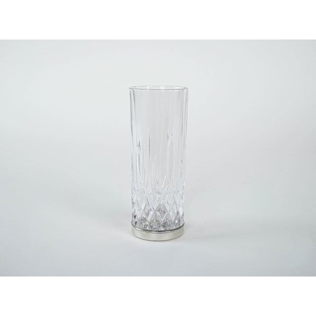 The set of glasses was made in the 1960s in Italy. A set of 6 tall crystal glasses with geometric cut and an elegant...