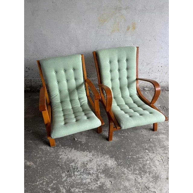 Set of 2 vintage lounge chairs with mint green cushions elegant set of two vintage lounge chairs with curved wooden...