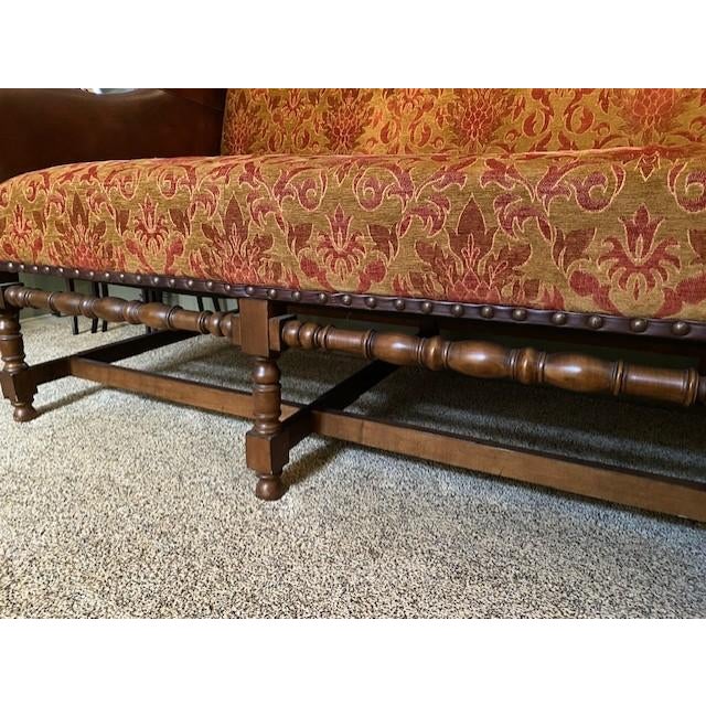 Reproduction Tuscany style hand carved open leg sofa by Century with hand dyed and finished leather back and arms with...