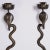 Standout pair of vintage Anglo Indian cobra or snake wall sconces crafted in brass with etched floral and geometric...