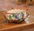 Bring colorful charm and whimsical craftsmanship to a tabletop or console with this elegant antique barbotine jardinière...