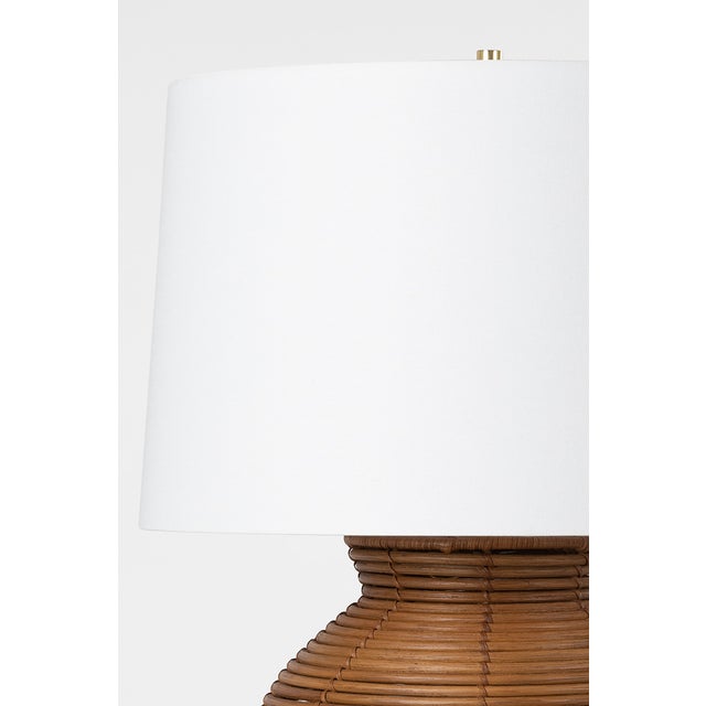 Newark is familiar in shape, large in scale and effortlessly usable. The natural rattan base pairs with a white Belgian...