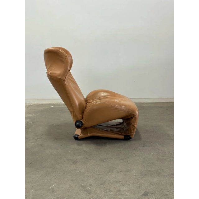 Chair W31 D32 H40 SW28 SD22 SH16 Chaise W31 D70 H31 Done in a genuine saddle brown leather with black details to match....