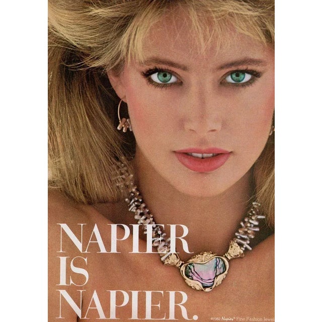 Moderist goldtone oval mother of pearl clip and screw back earrings. Marked "NAPIER©." Measure: 1 1/8 inches long by 7/8...