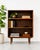 Simple + Classic Mid Century Modern ROSEWOOD bookcase, c. 1960's. This stunning piece features three wide and long...