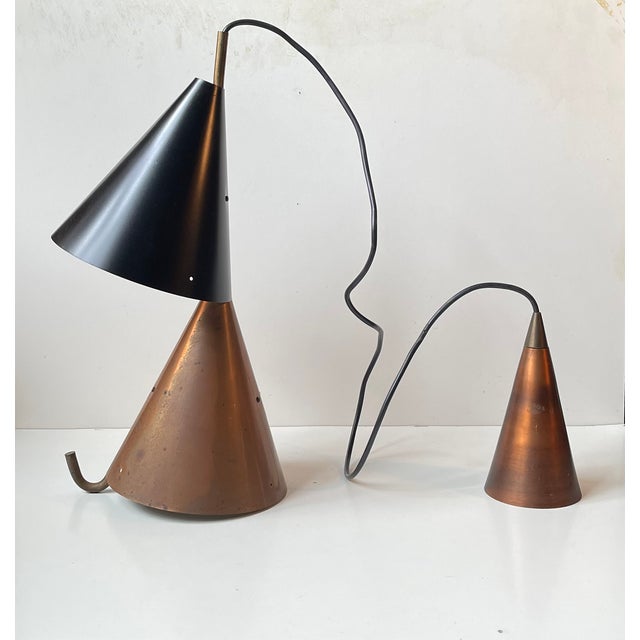 Probably one of the rarest designs by Holm-Sørensen. This double light executed in copper, brass and black painted...