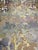 This fabric is a modern camouflage with a mix of colors like green, blue, purple, silver. It has a medium hand and is it...
