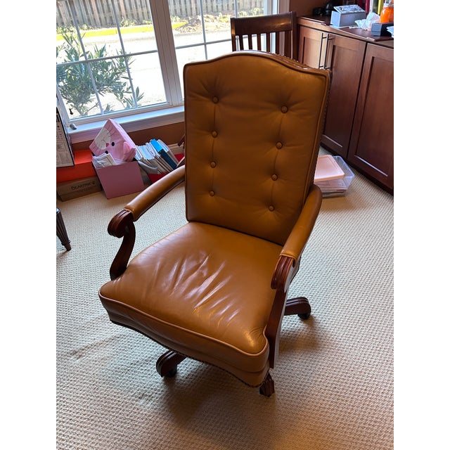 A classic executive desk chair by Ethan Allen, featuring the iconic Harvard design known for its timeless elegance and...