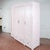 This spacious four-door wardrobe, dating from the first half of the 20th century, represents an interesting fusion of...