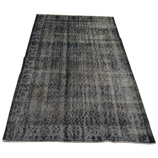 Hand-knotted with care using traditional rug-making techniques, this wool rug blends timeless craftsmanship with a modern...