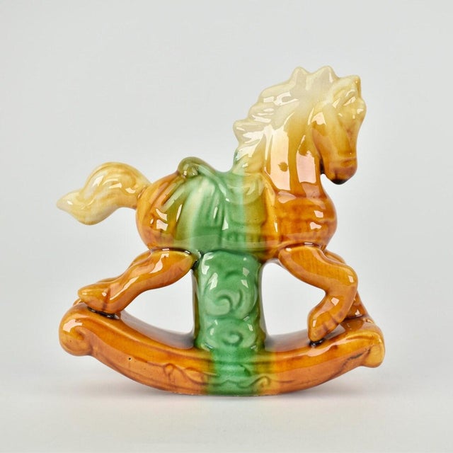 Rare vintage Tang Dynastystyle rocking horse figurine, crafted in the 1970s. Featuring a stunning multicolor drip glaze...