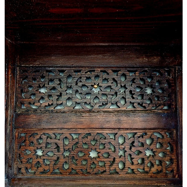 Bring the charm of traditional Moroccan craftsmanship into your home with this beautifully hand-carved wooden wall shelf....