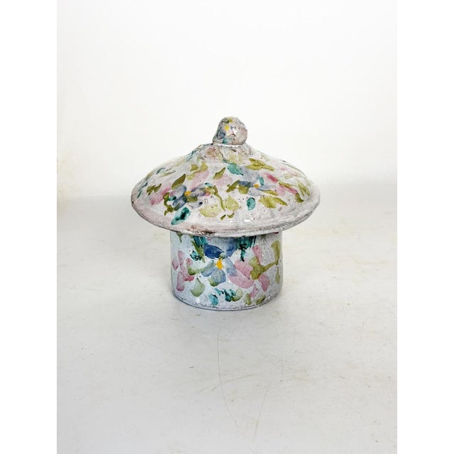 Charming vintage ceramic box from Vallauris, adorned with a hand-painted design of colorful, abstract motifs. The white...