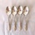Vintage set of 4 silver-plate table spoons with floral design 6.75"L , Makers mark reads " 1881 Rogers Silver Plate"...