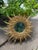 A very glamorous French Style Gilded Resin Sunburst Wall Mirror from the 1960s. This fabulous 16.5" wall mirror features...