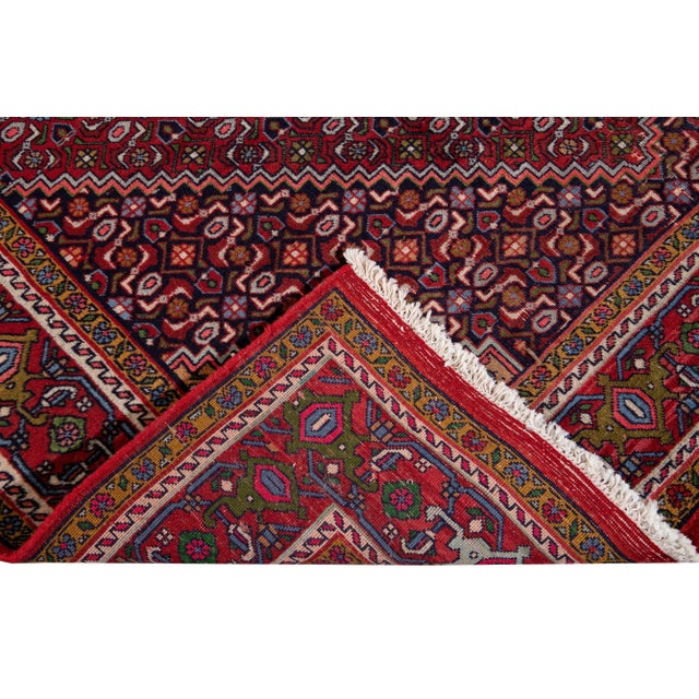Beautiful antique Bidjar hand-knotted wool rug with burgundy field. This piece has multicolor accents with an all-over...