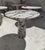 This minimalist table is crafted from Viola-veined marble, showcasing a circular tabletop that balances securely and...