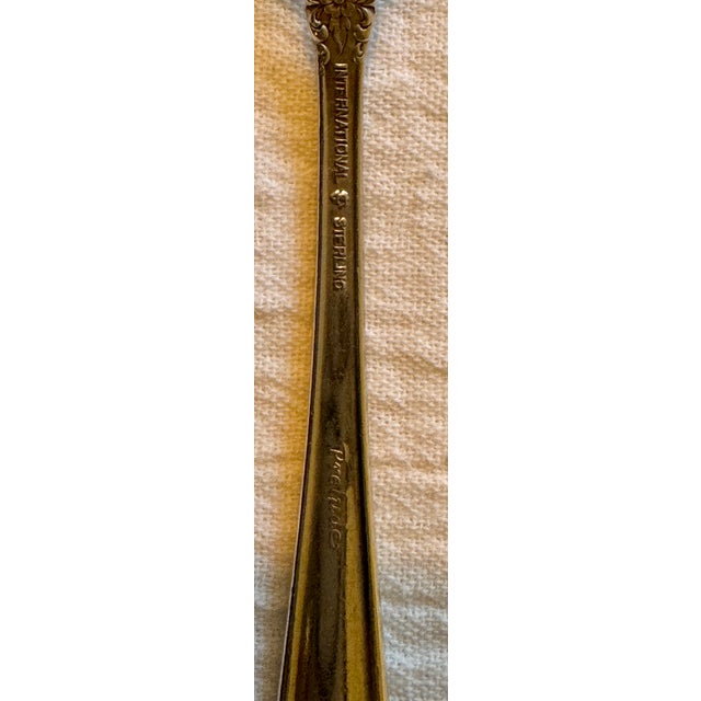 Beautiful vintage set of child’s knife and fork from International Silver. The sterling set features flowers on the base...