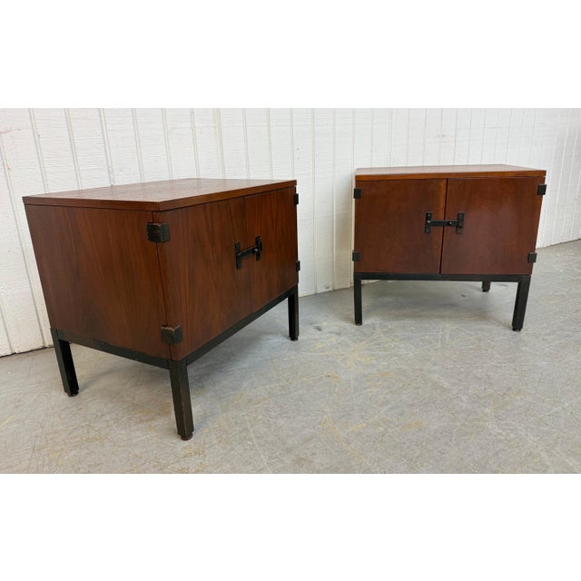 This sophisticated pair of Mid-Century Modern walnut nightstands by Directional for designer Milo Baughman exemplifies...