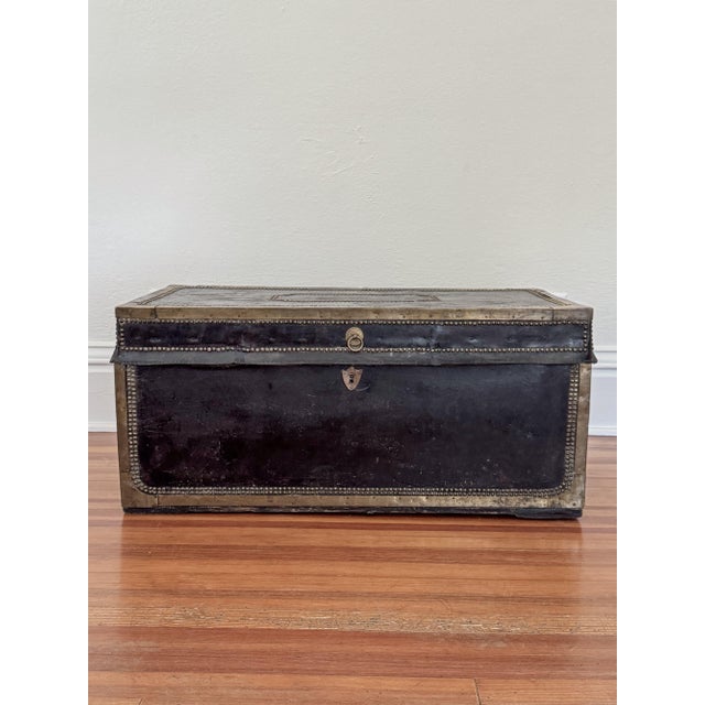 19th century English camphor wood and leather trunk. Brass nailheads throughout, brass hardware at edges, and brass...