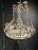 A circa 1930 French Bagues light fixture with crystal leaves and flowers and 6 interior lights