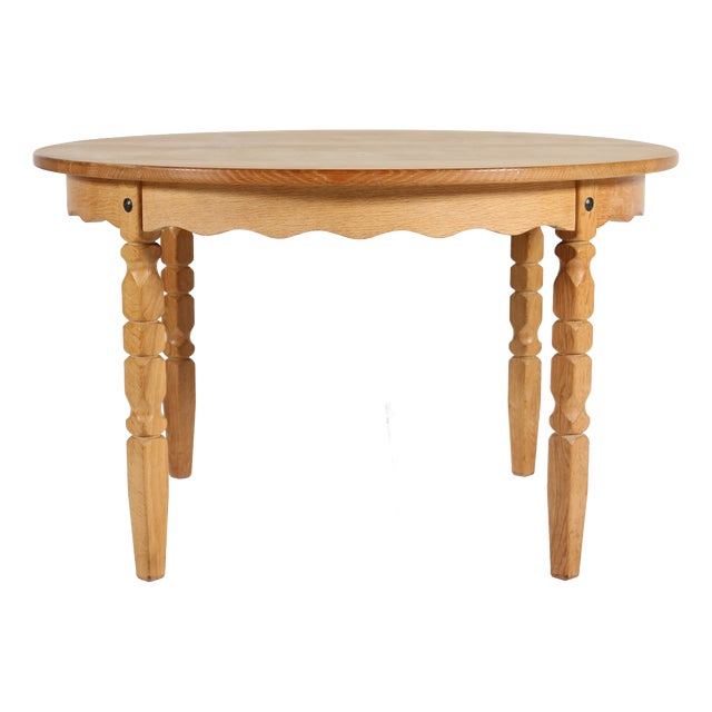 Danish Round Extendable Dining Table in Oak in the style of Henning Kjærnulf, 1970s For Sale