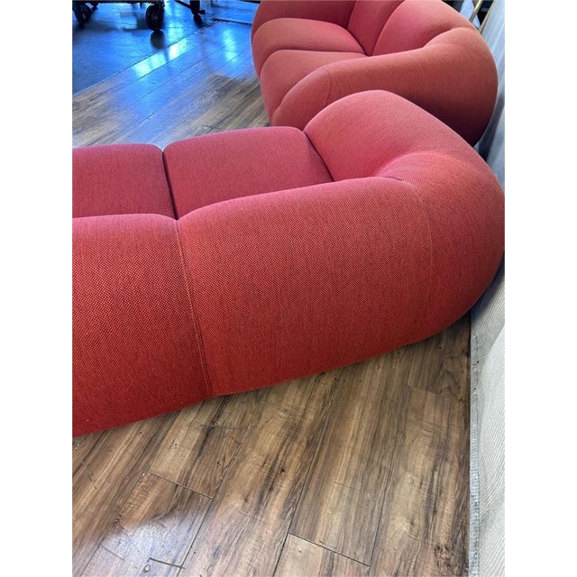 A wonderful Steve Chase designed modern sofa done in a red chenille ,faded. Biography: His work has won numerous design...