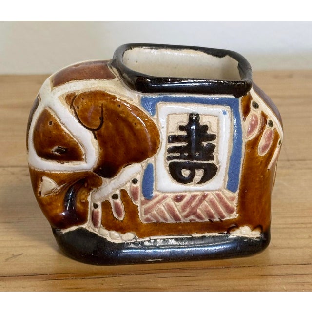 Whimsy meets function with this vintage ceramic miniature elephant garden stool style vessel. Would make a perfect...