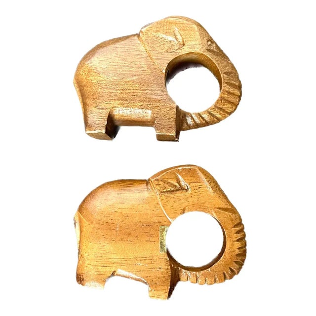 Set of four vintage carved walnut animal napkin rings. Two elephants and two whales. Marked "Made In The Philippines" on...