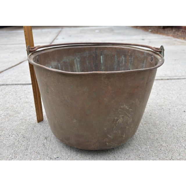 This is an American copper bucket with a slight convex bottom. It weights approximately 3 pounds and came from the...