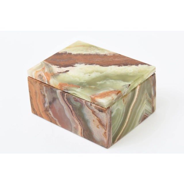 This mid century modern vintage lidded alabaster small box is from the 50's. It looks like slices of agate in swirls of...
