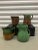 Set of (4) collectable Green Jugs. Some with yellow, brow and green glazed. Sizes from 6"H to 7"H.