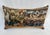 A charming decorative pillow crafted from an exquisite 18th-century tapestry featuring a striking pattern of beautifully...